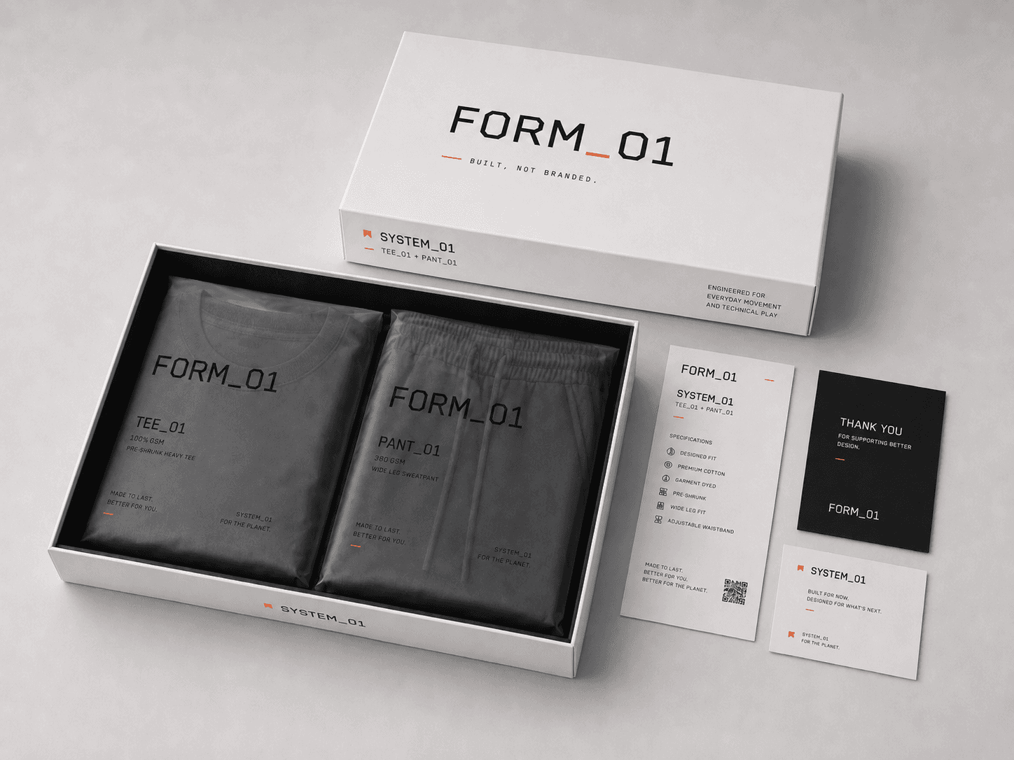 FORM_01 SYSTEM_01 packaging with tee, pant, specification card, and thank-you card